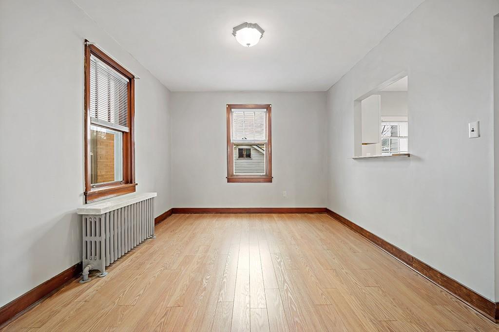 1167 Race Street McKees Rocks, PA 15136 - Photo 6 of 25 wooden floor in an empty room with a window