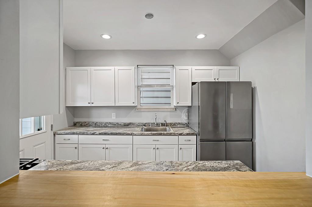 1167 Race Street McKees Rocks, PA 15136 - Photo 9 of 25 a kitchen with stainless steel appliances granite countertop a refrigerator sink and cabinets