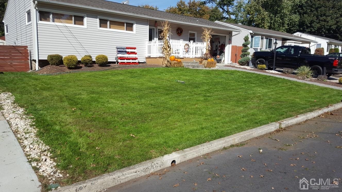 21 Columbia Road Old Bridge, NJ 08859 - Photo 14 of 25 a front view of house with yard and seating area