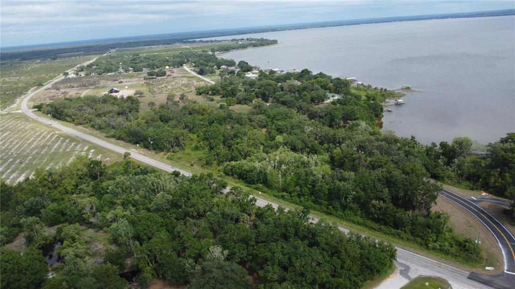 742 North Lake Reedy Boulevard Frostproof, FL 33843 - Photo 16 of 19 an aerial view of a residential houses with outdoor space and trees