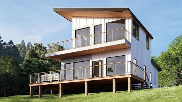 a front view of residential houses with yard