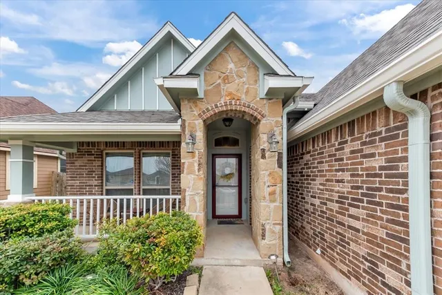 a front view of a house with a porch