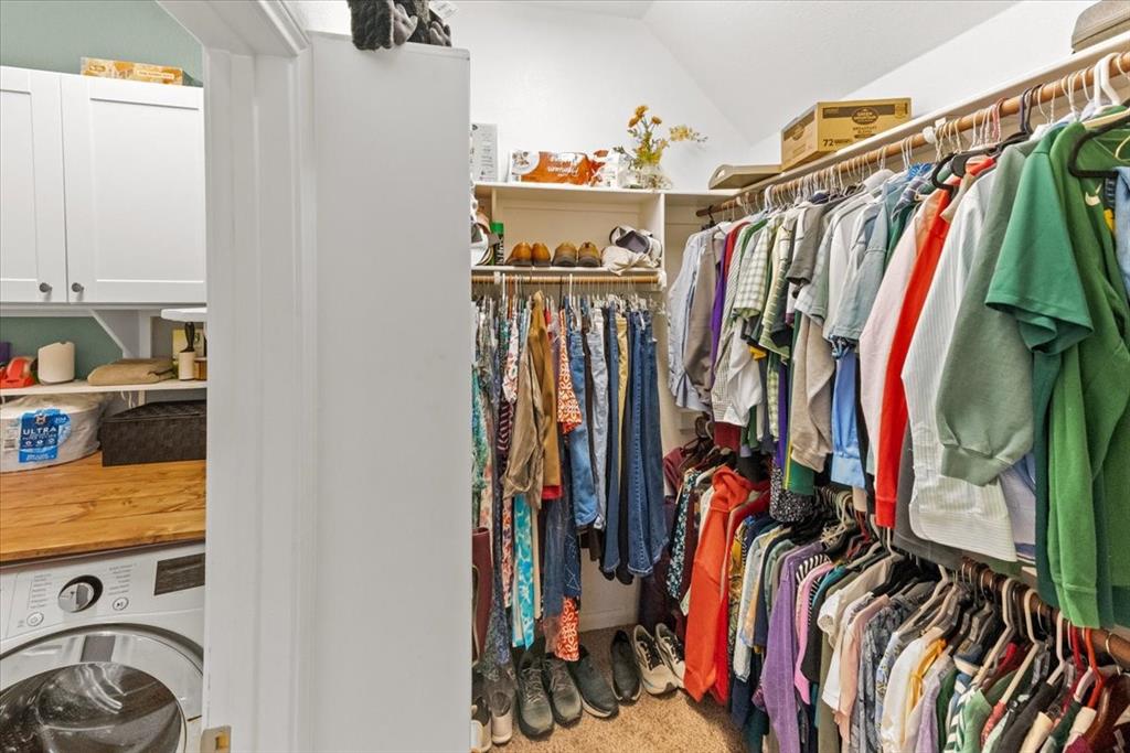 10861 Burnham Drive Waco, TX 76708 - Photo 19 of 27 a view of walk in closet with clothes and shoes