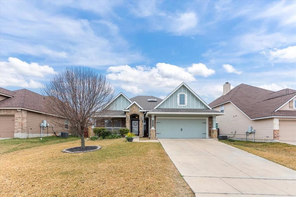 10861 Burnham Drive Waco, TX 76708 - Photo 2 of 27 a front view of a house with a yard and garage