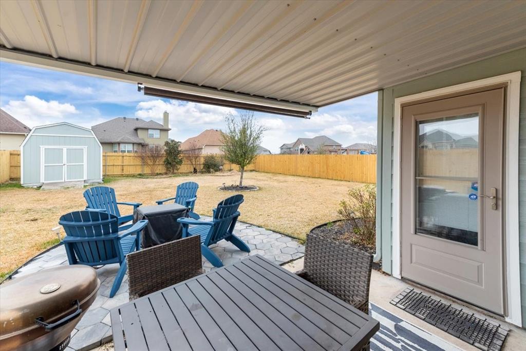 10861 Burnham Drive Waco, TX 76708 - Photo 22 of 27 a living room with furniture floor to ceiling window and wooden floor