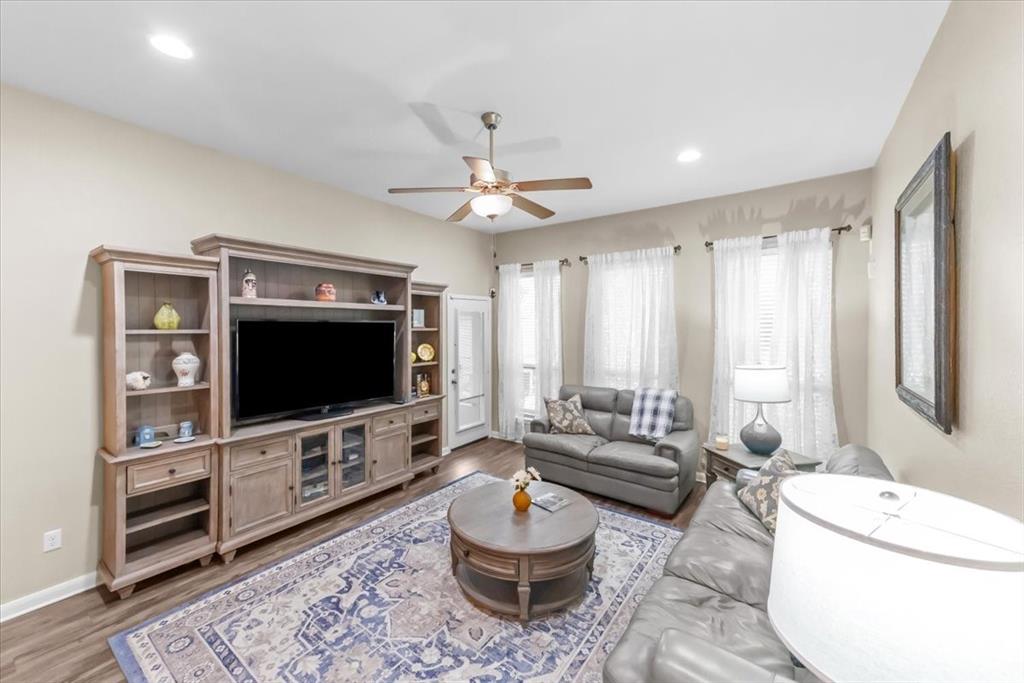 10861 Burnham Drive Waco, TX 76708 - Photo 9 of 27 a living room with furniture and a flat screen tv