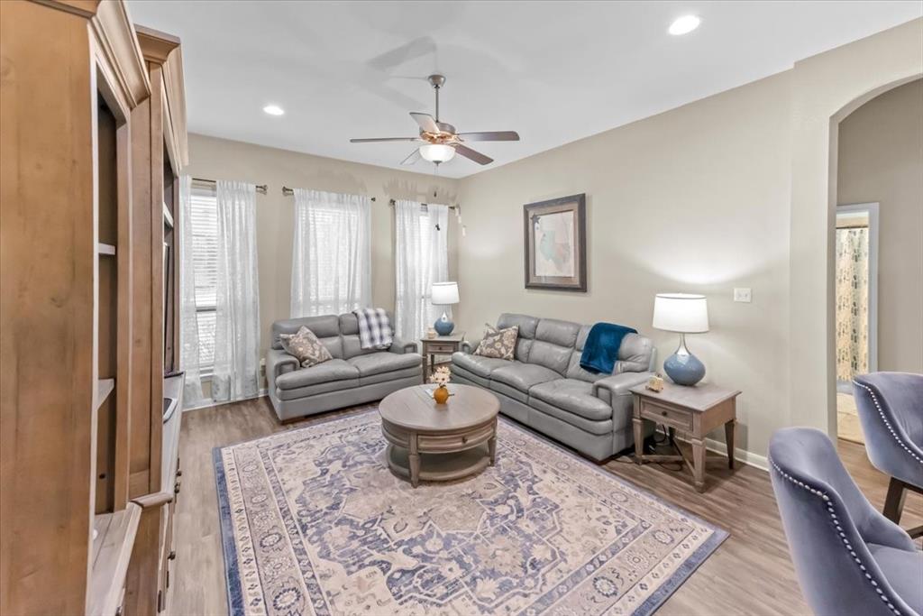 10861 Burnham Drive Waco, TX 76708 - Photo 10 of 27 a living room with furniture and a chandelier