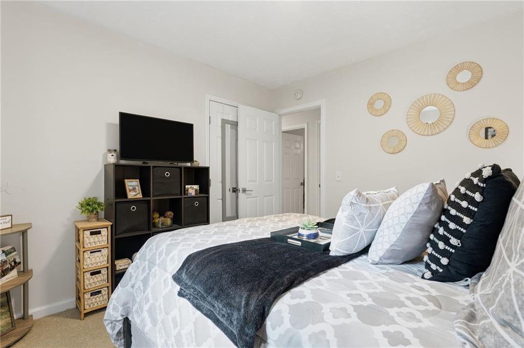 404 Brooks Street Dallas, GA 30157 - Photo 25 of 38 a bedroom with a bed and a television