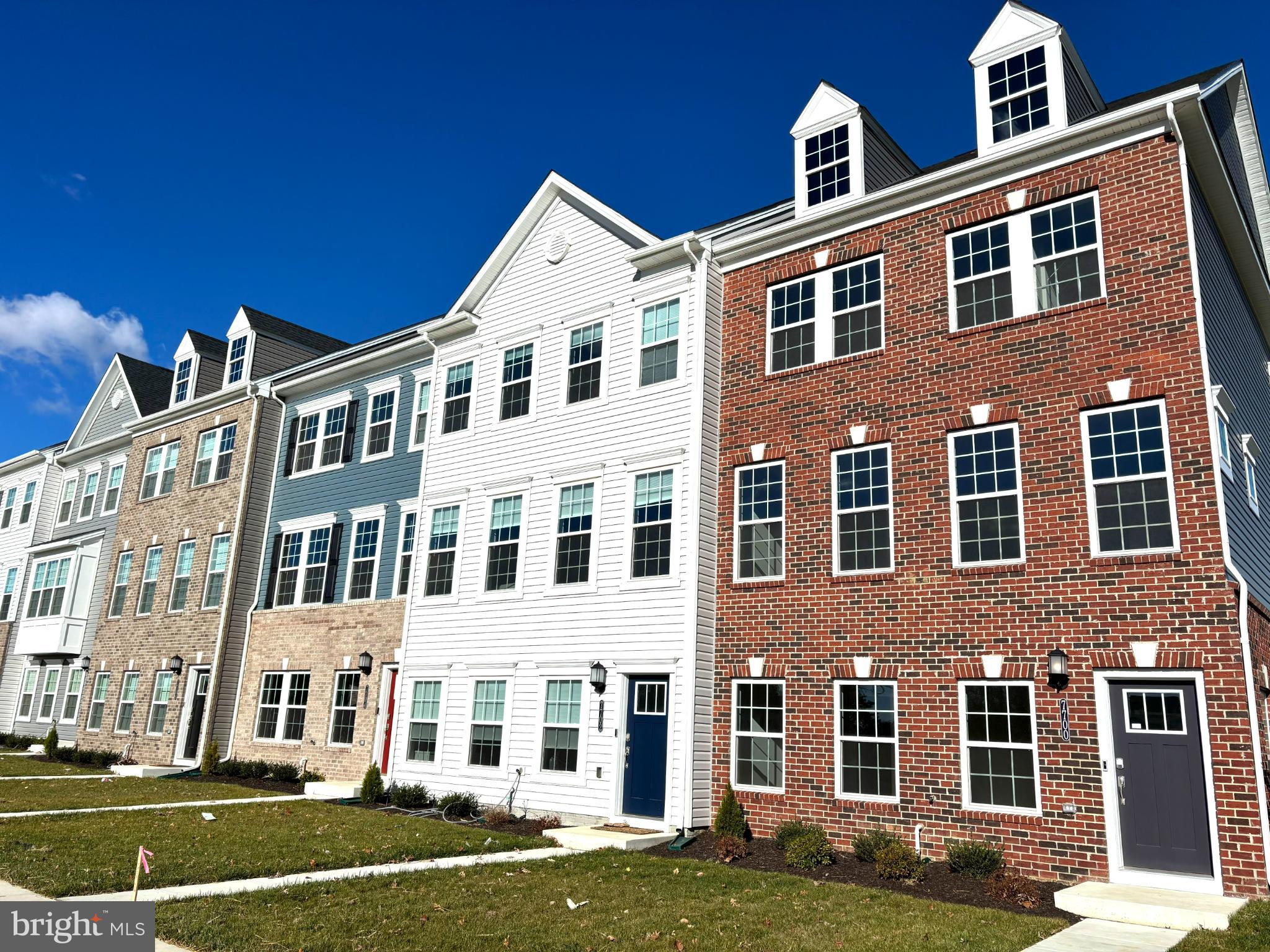 a front view of a building with a yard