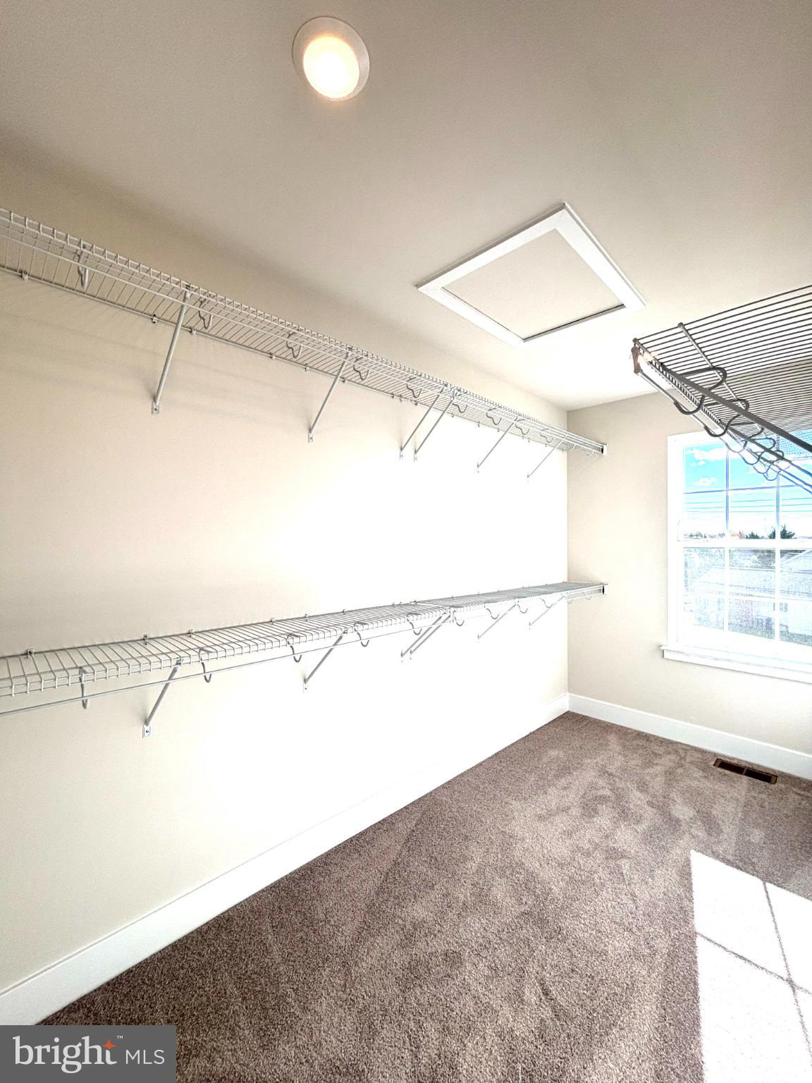 7700 Johnnycake Road Windsor Mill, MD 21244 - Photo 14 of 17 a view of a room with racks on the wall