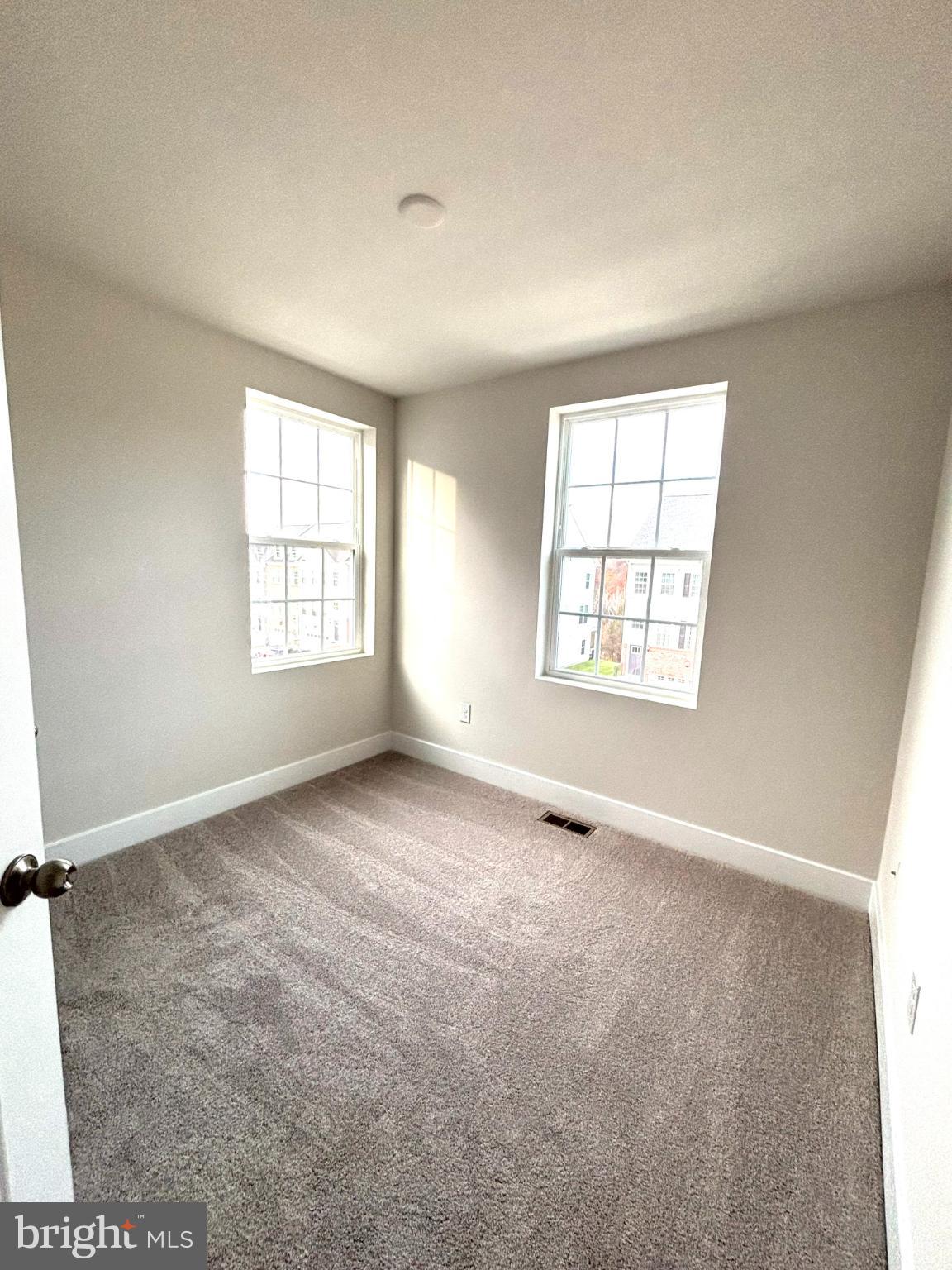 7700 Johnnycake Road Windsor Mill, MD 21244 - Photo 16 of 17 an empty room with windows