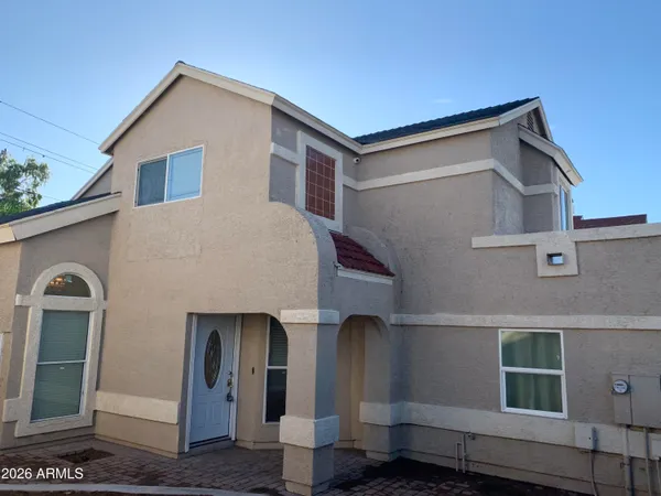 a front view of a house with parking area