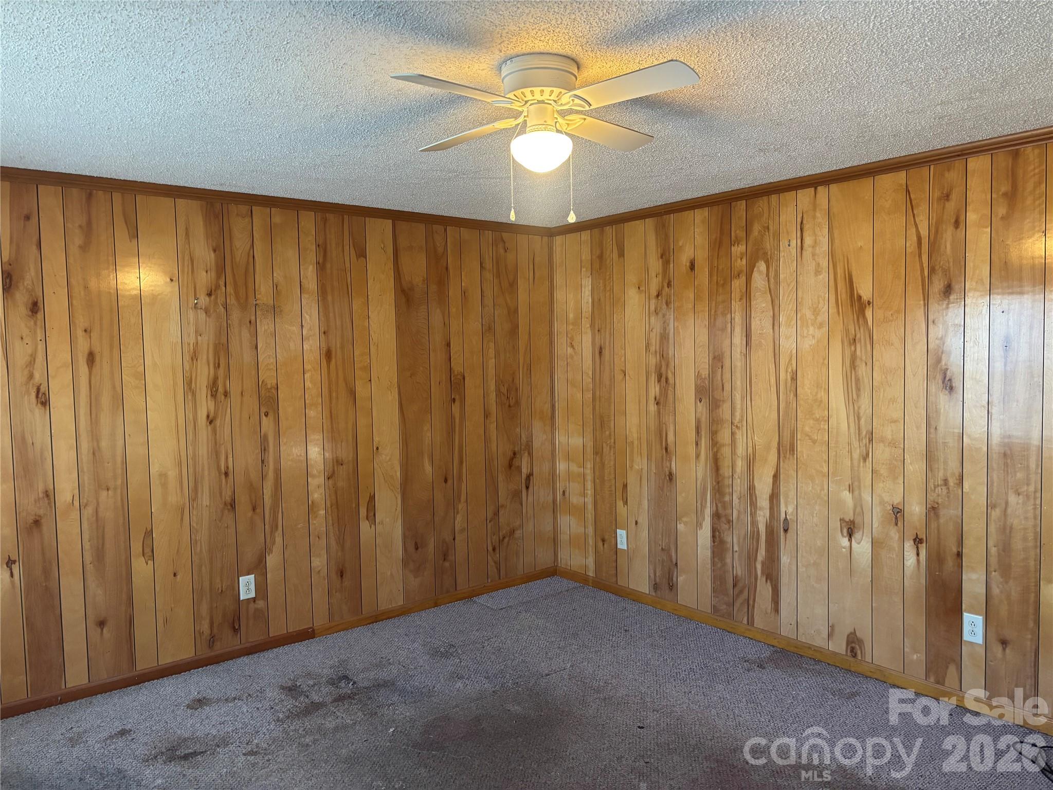 4000 Ansonville Road Marshville, NC 28103 - Photo 12 of 22 a view of a big room with a chandelier fan and a large window