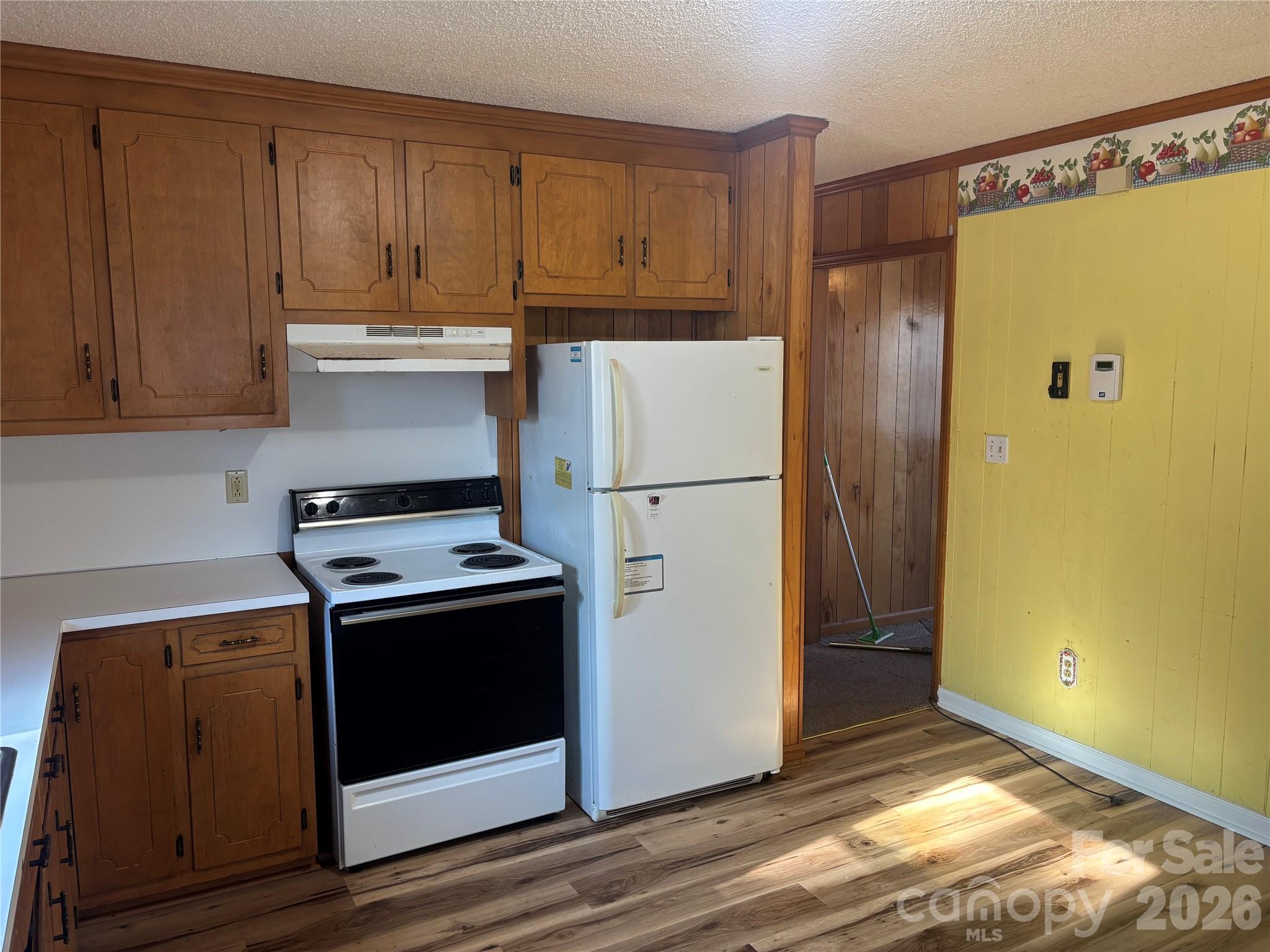 4000 Ansonville Road Marshville, NC 28103 - Photo 14 of 22 a kitchen with a refrigerator sink and cabinets