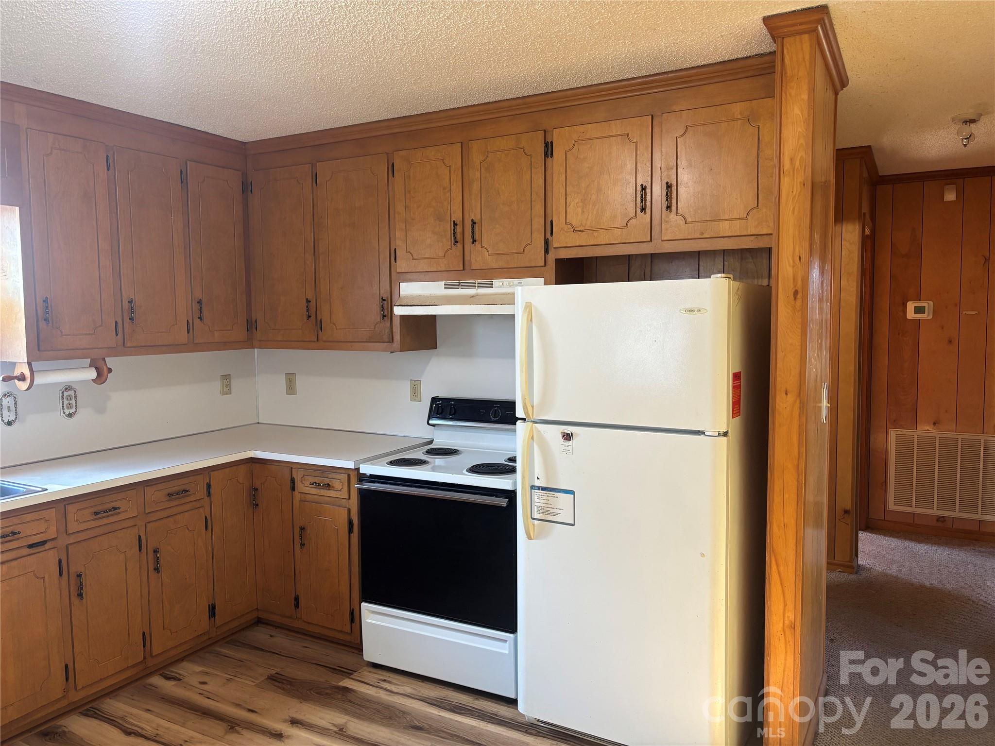 4000 Ansonville Road Marshville, NC 28103 - Photo 15 of 22 a white refrigerator freezer sitting inside of a kitchen