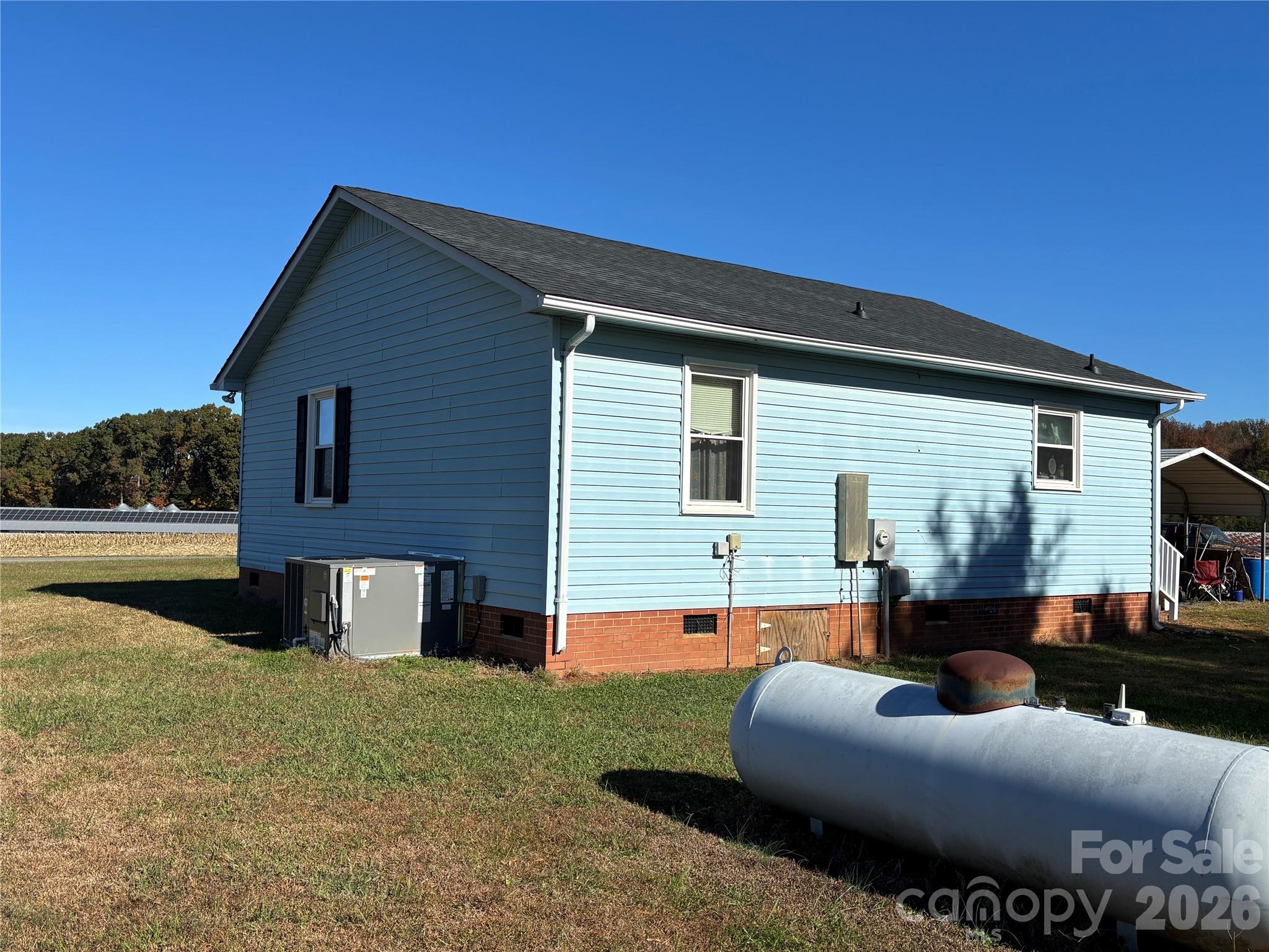 4000 Ansonville Road Marshville, NC 28103 - Photo 5 of 22 a backyard of a house with table and chairs