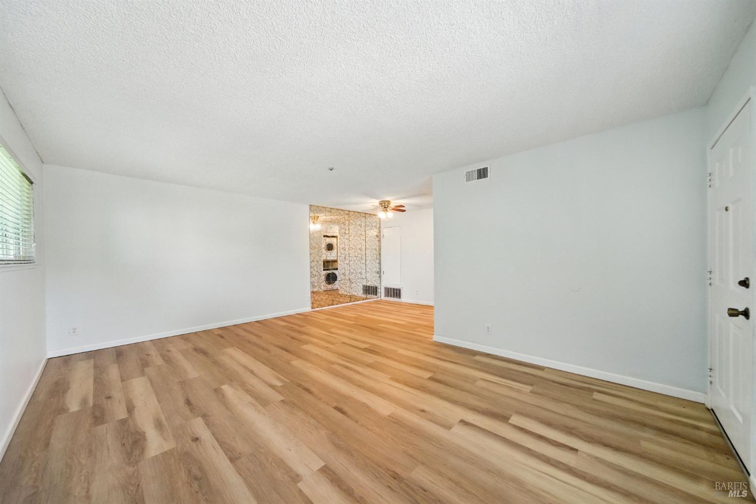 1890 Dorado Court Santa Rosa, CA 95403 - Photo 11 of 25 a view of empty room with wooden floor