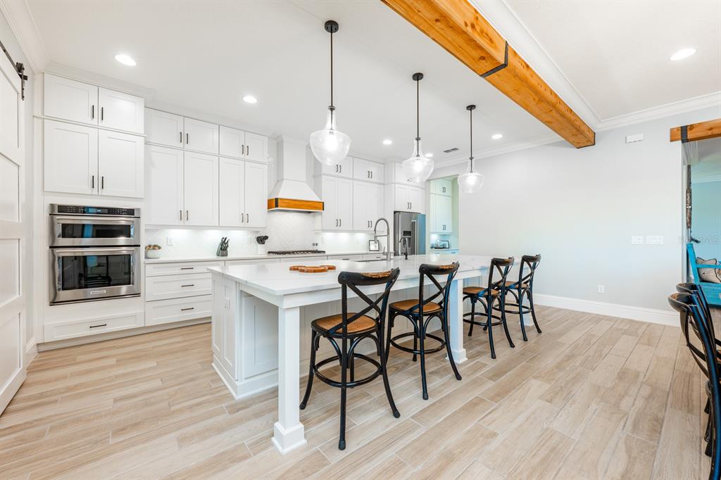 9014 Morgana Court Winter Garden, FL 34787 - Photo 12 of 55 a large kitchen with a table and chairs in it