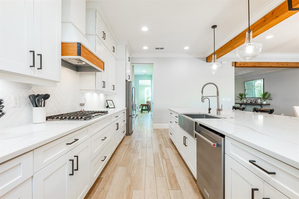 9014 Morgana Court Winter Garden, FL 34787 - Photo 13 of 55 a kitchen with stainless steel appliances a sink stove and cabinets