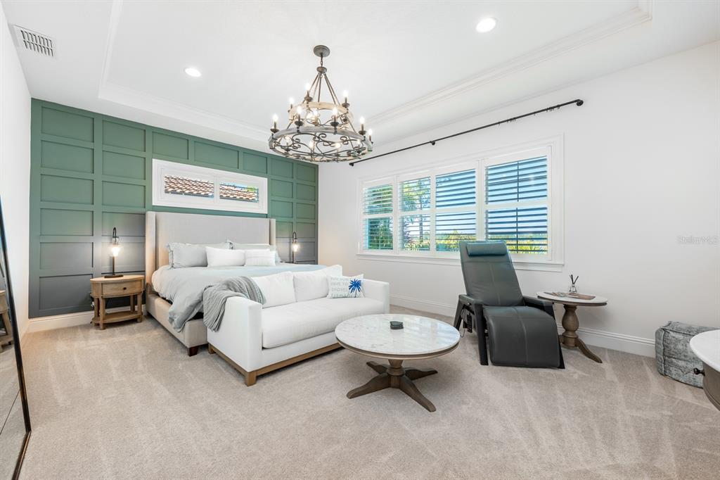 9014 Morgana Court Winter Garden, FL 34787 - Photo 20 of 55 a bed room with furniture and a chandelier