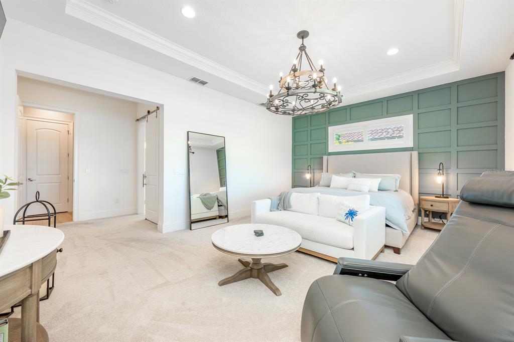 9014 Morgana Court Winter Garden, FL 34787 - Photo 21 of 55 a living room with furniture and a chandelier