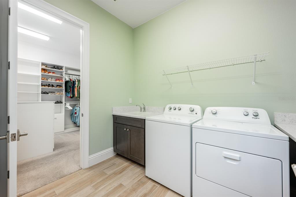 9014 Morgana Court Winter Garden, FL 34787 - Photo 26 of 55 a view of storage and utility room with washer and dryer