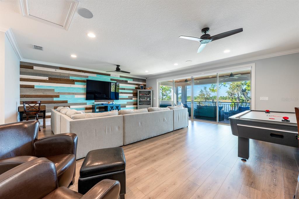 9014 Morgana Court Winter Garden, FL 34787 - Photo 29 of 55 a kitchen with a table chairs refrigerator and a window
