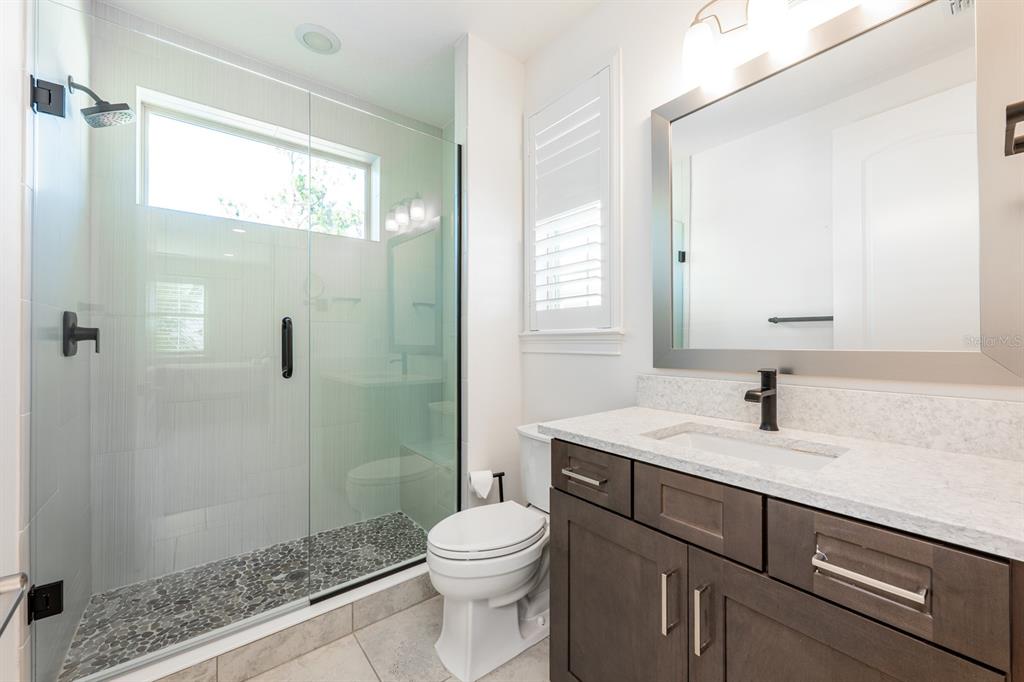 9014 Morgana Court Winter Garden, FL 34787 - Photo 32 of 55 a bathroom with a sink a toilet and shower