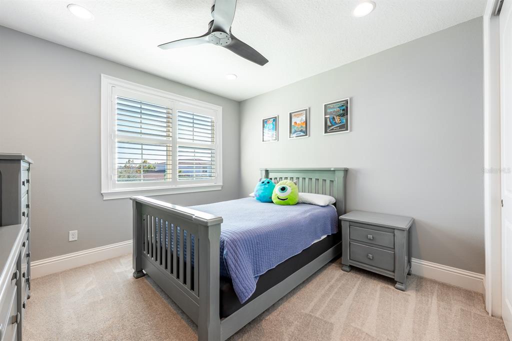 9014 Morgana Court Winter Garden, FL 34787 - Photo 36 of 55 a bedroom with a bed and a window