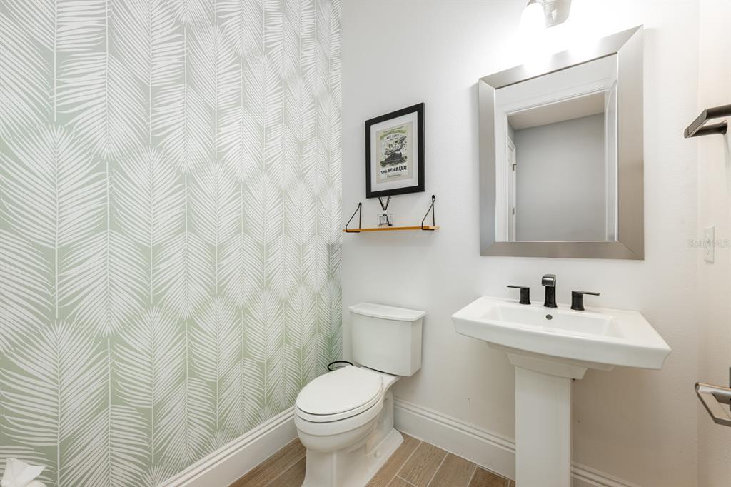 9014 Morgana Court Winter Garden, FL 34787 - Photo 37 of 55 a bathroom with a toilet sink and mirror