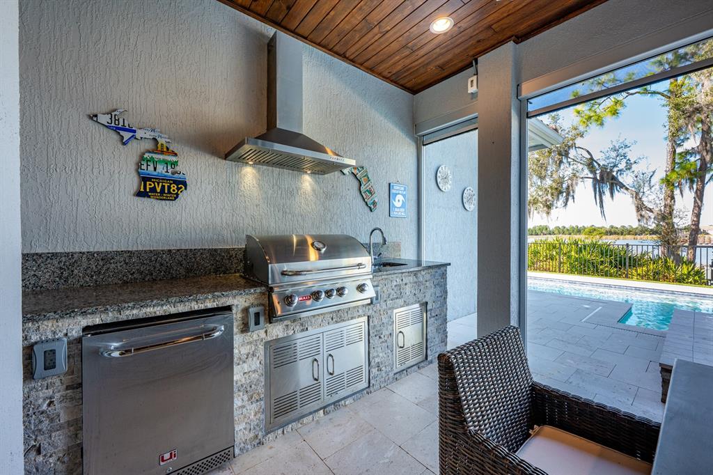 9014 Morgana Court Winter Garden, FL 34787 - Photo 40 of 55 a kitchen with a stove and a refrigerator