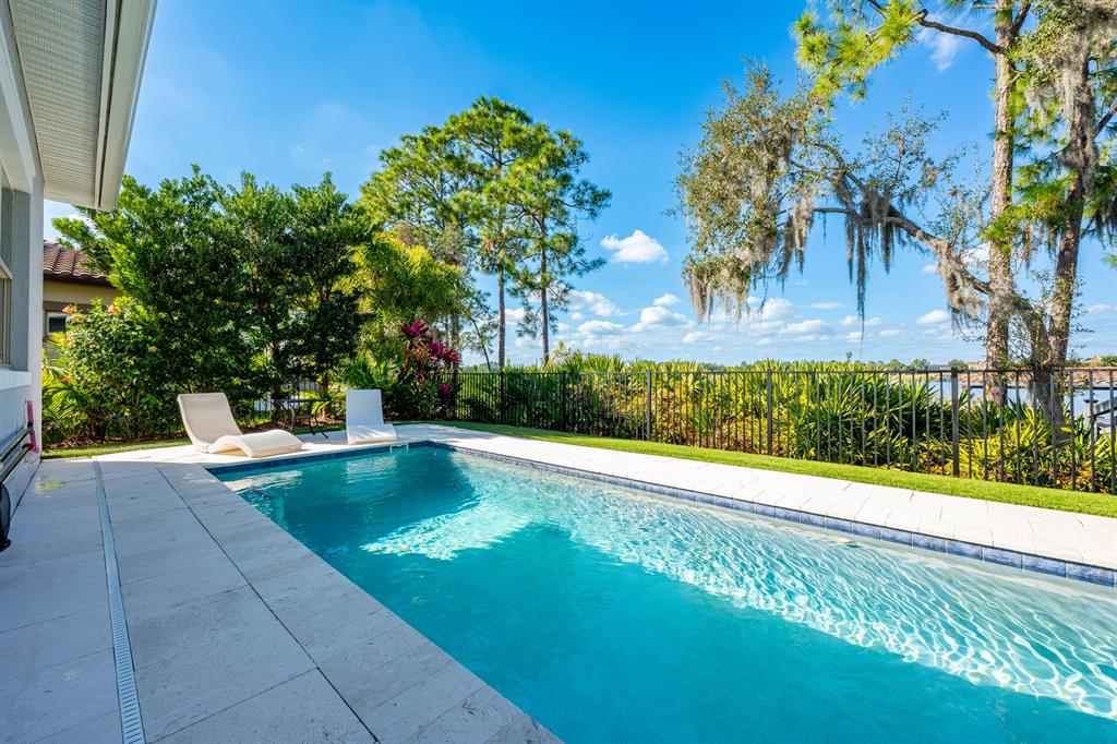 9014 Morgana Court Winter Garden, FL 34787 - Photo 42 of 55 a view of a swimming pool with a patio