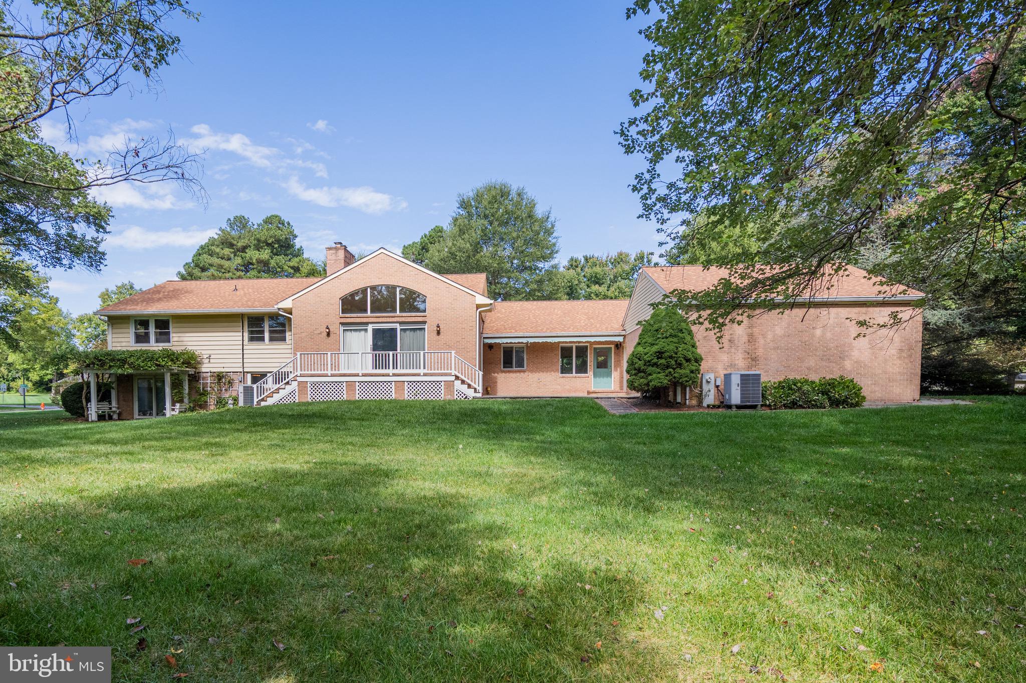 5002 Durham Road East Columbia, MD 21044 - Photo 14 of 62 a front view of a house with a garden