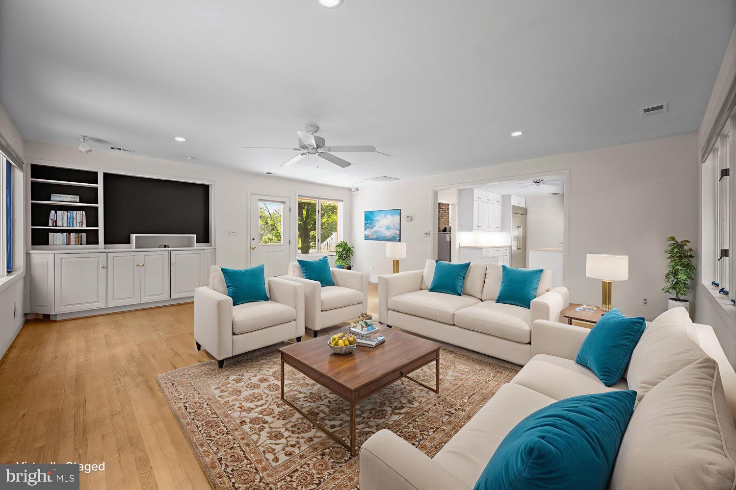 5002 Durham Road East Columbia, MD 21044 - Photo 22 of 62 a living room with furniture and a flat screen tv