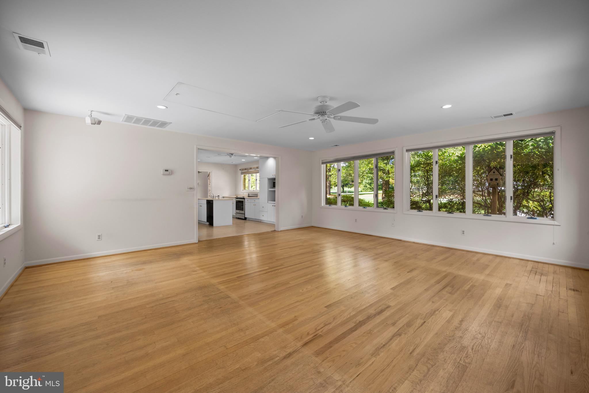 5002 Durham Road East Columbia, MD 21044 - Photo 23 of 62 an empty room with wooden floor and windows