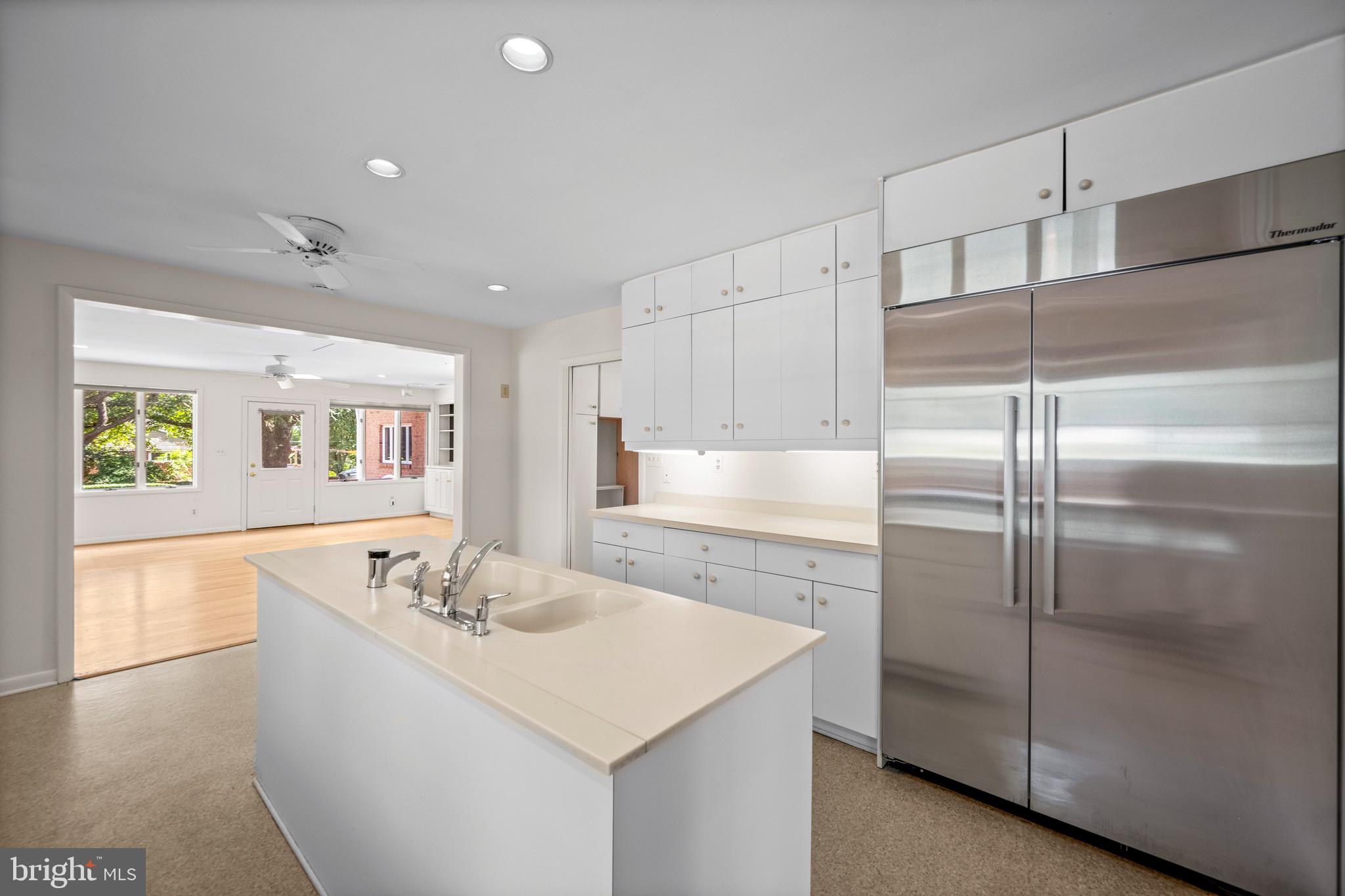 5002 Durham Road East Columbia, MD 21044 - Photo 30 of 62 a kitchen with kitchen island a counter top space cabinets and stainless steel appliances