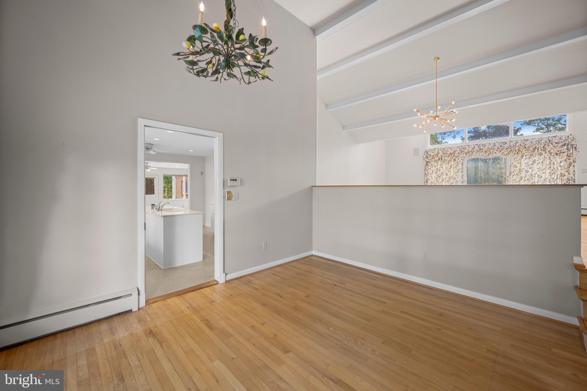 5002 Durham Road East Columbia, MD 21044 - Photo 33 of 62 a view of a room with wooden floor and chandelier
