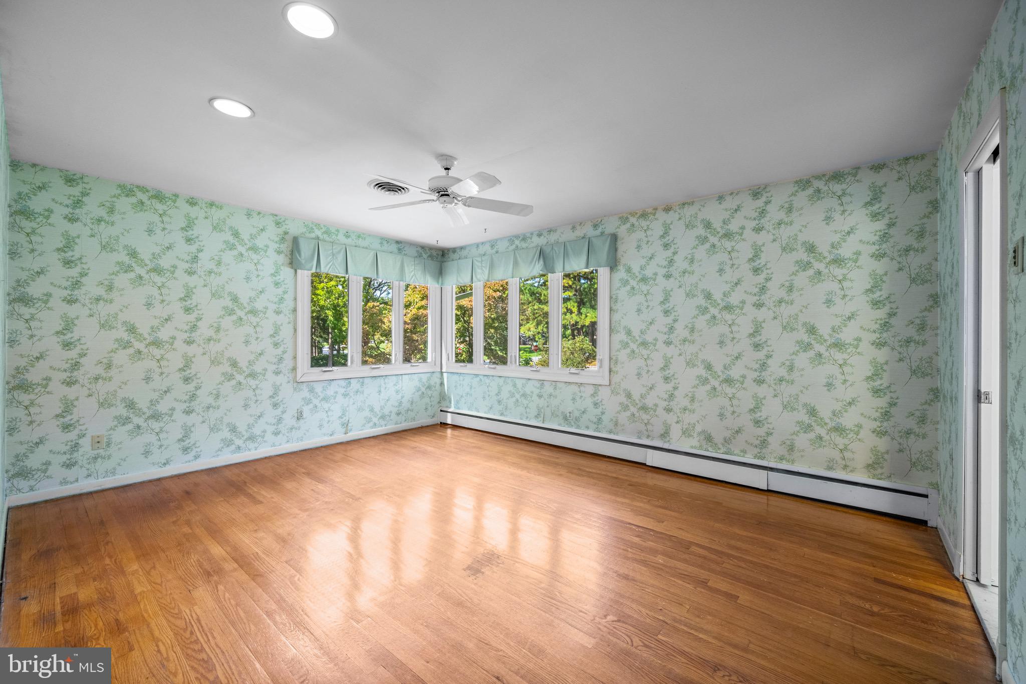 5002 Durham Road East Columbia, MD 21044 - Photo 39 of 62 a view of an empty room with a window and wooden floor