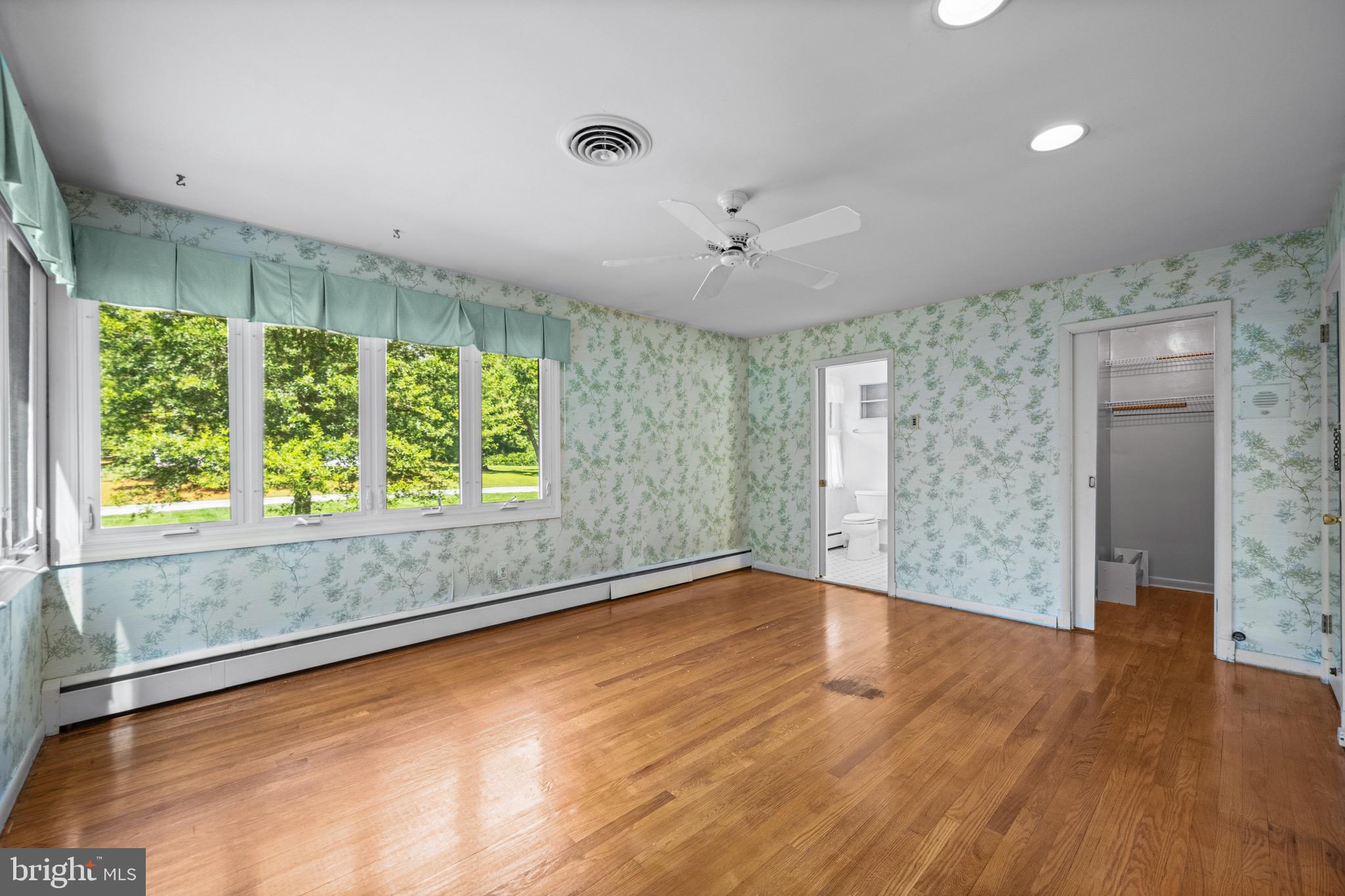 5002 Durham Road East Columbia, MD 21044 - Photo 40 of 62 an empty room with wooden floor and windows