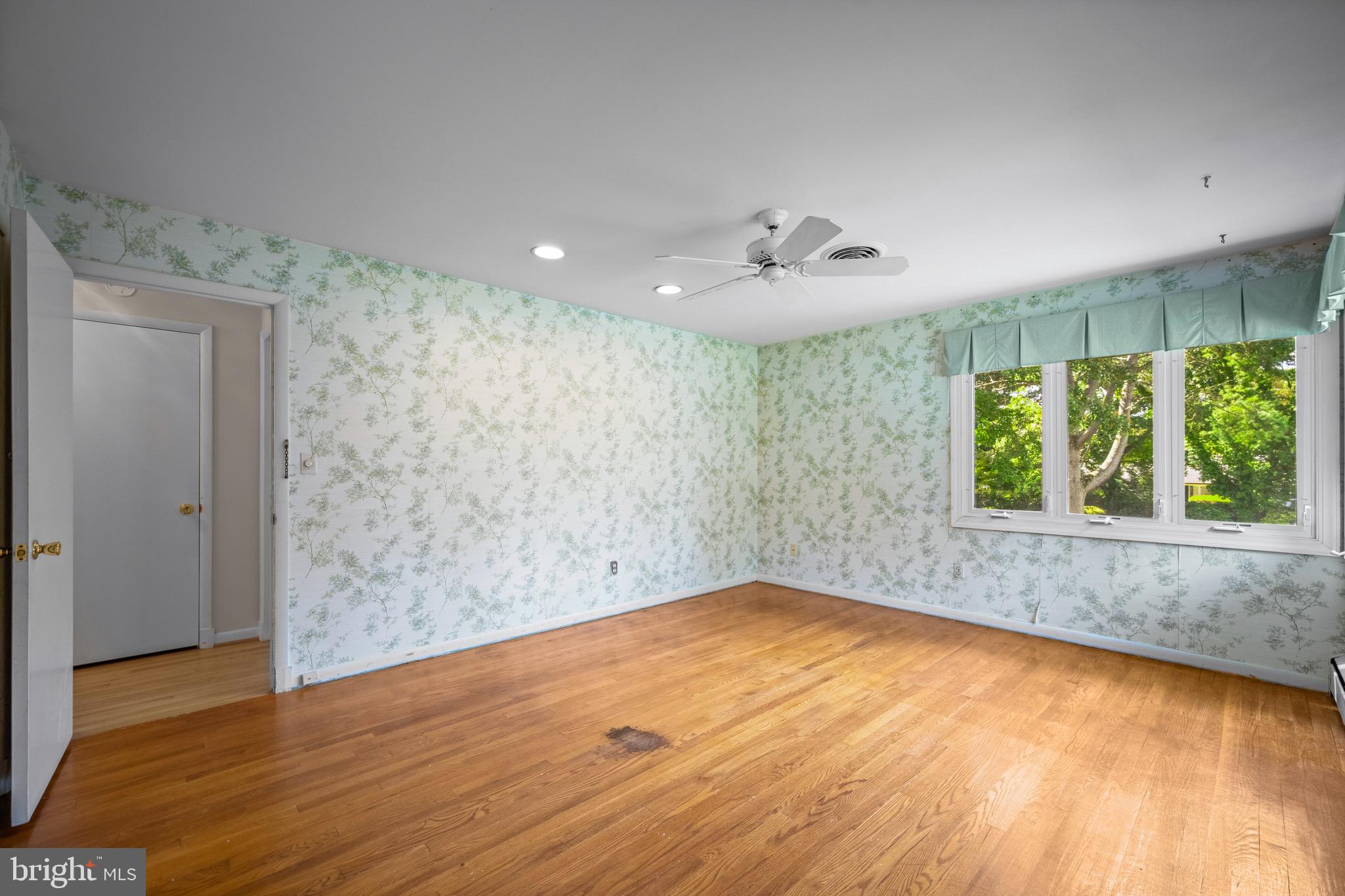 5002 Durham Road East Columbia, MD 21044 - Photo 42 of 62 wooden floor in an empty room with a window