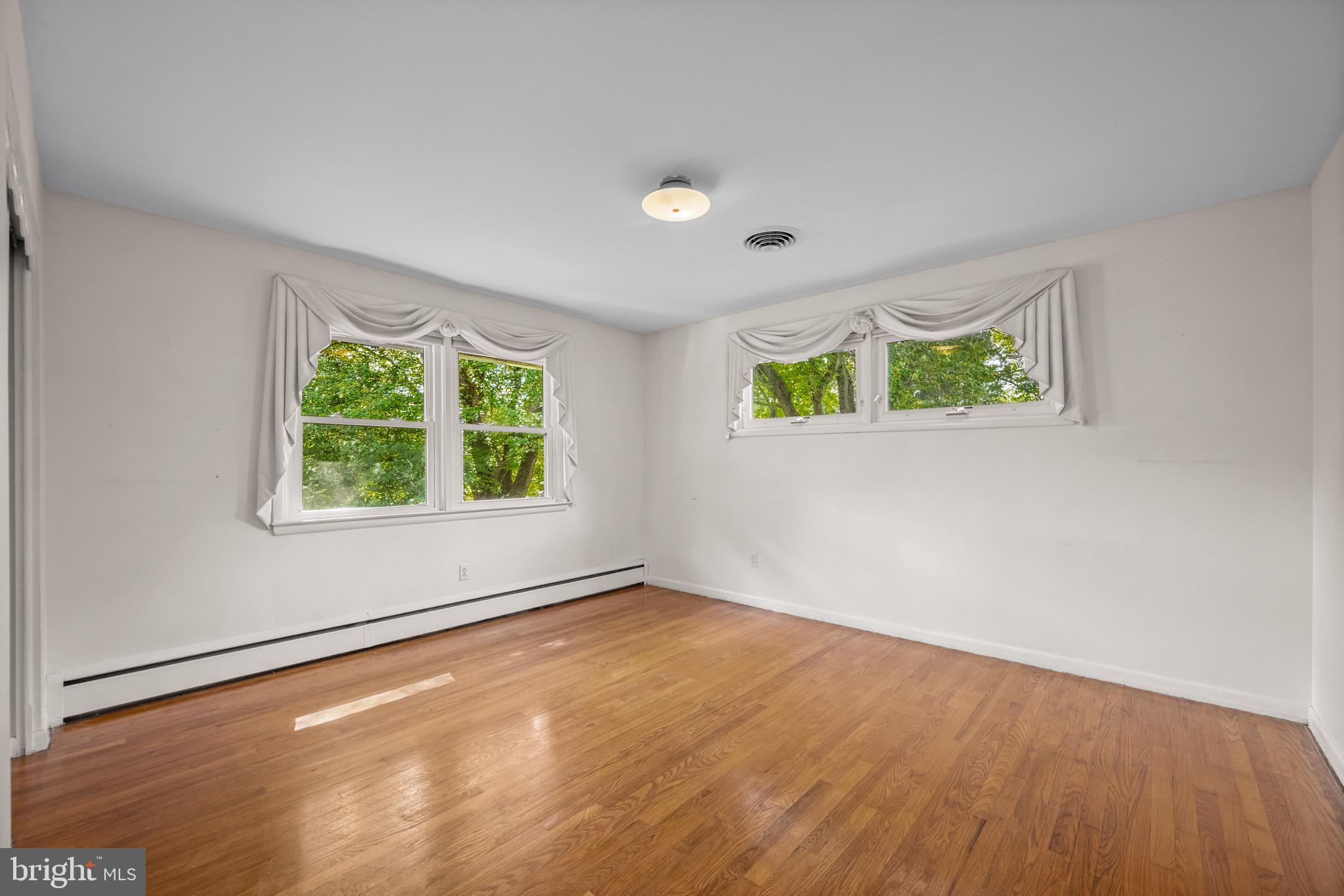 5002 Durham Road East Columbia, MD 21044 - Photo 44 of 62 Second bedroom with lots of light, hardwood floors