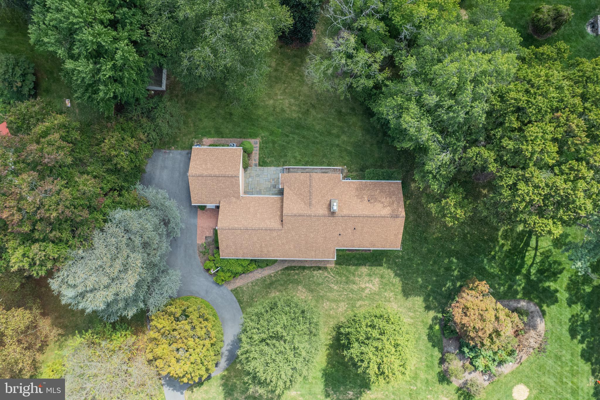 5002 Durham Road East Columbia, MD 21044 - Photo 8 of 62 an aerial view of a house with garden space and trees all around
