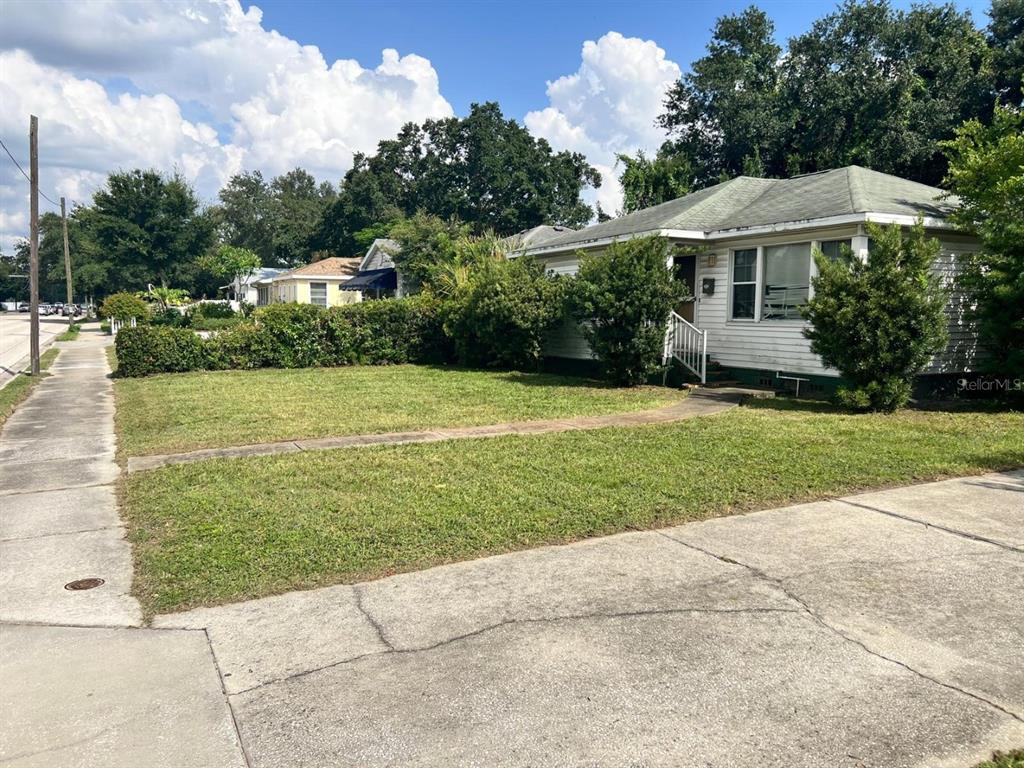 3620 West Azeele Street Tampa, FL 33609 - Photo 2 of 5 a view of a house with a yard