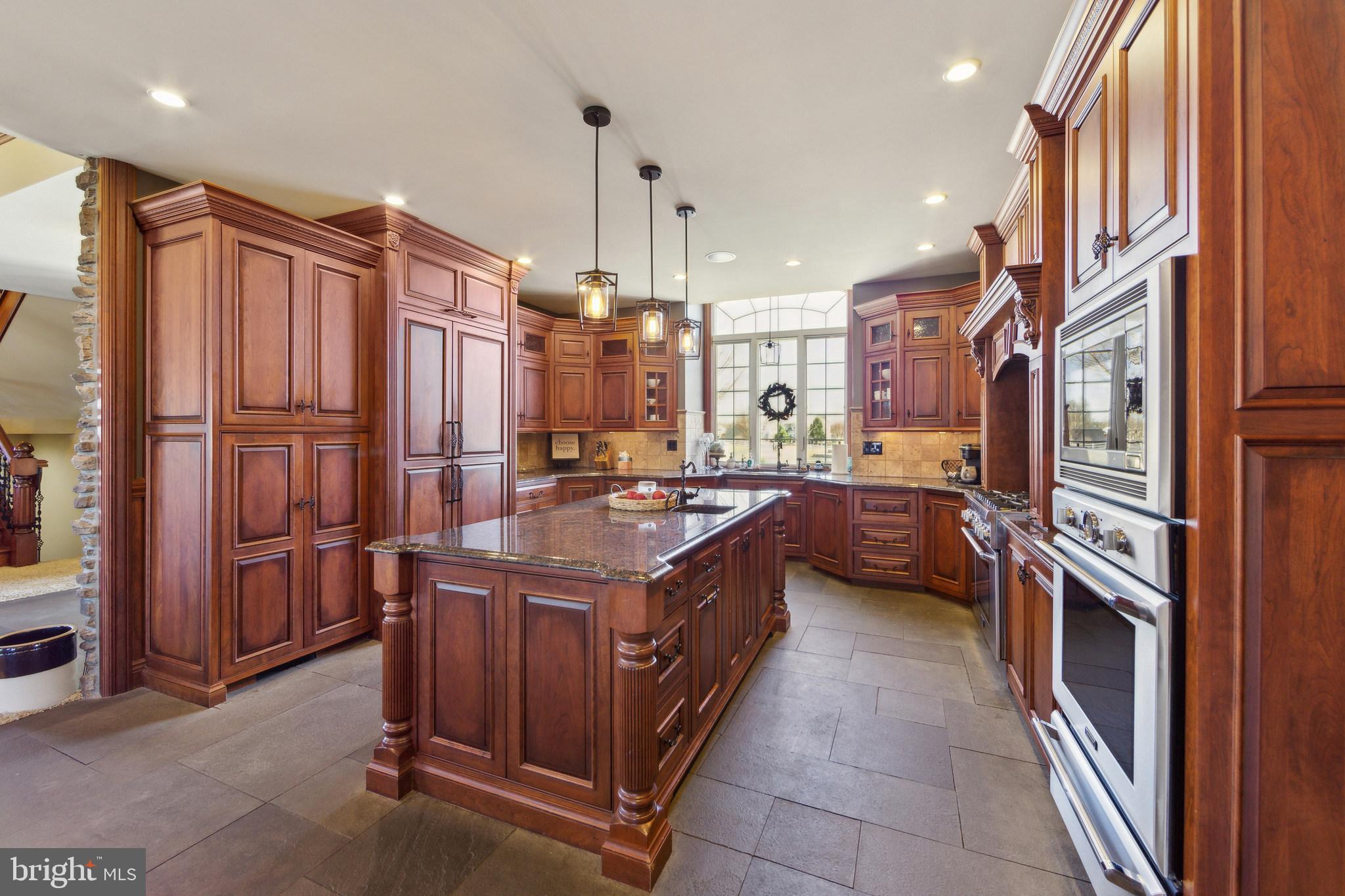 86 Sunset Road Royersford, PA 19468 - Photo 17 of 75 a kitchen with stainless steel appliances granite countertop a sink a stove and a refrigerator