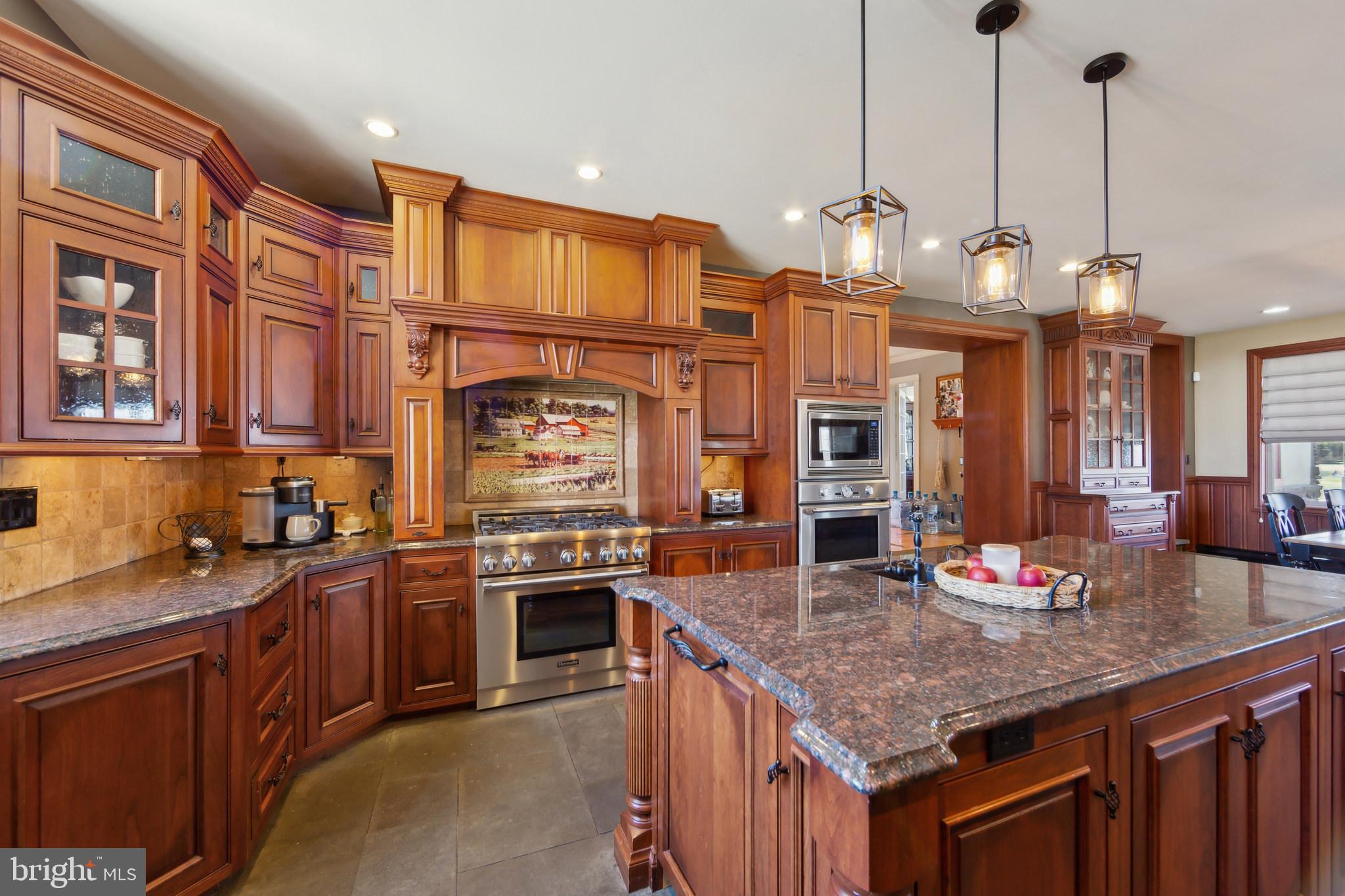 86 Sunset Road Royersford, PA 19468 - Photo 18 of 75 a kitchen with stainless steel appliances granite countertop a kitchen island a stove and a sink