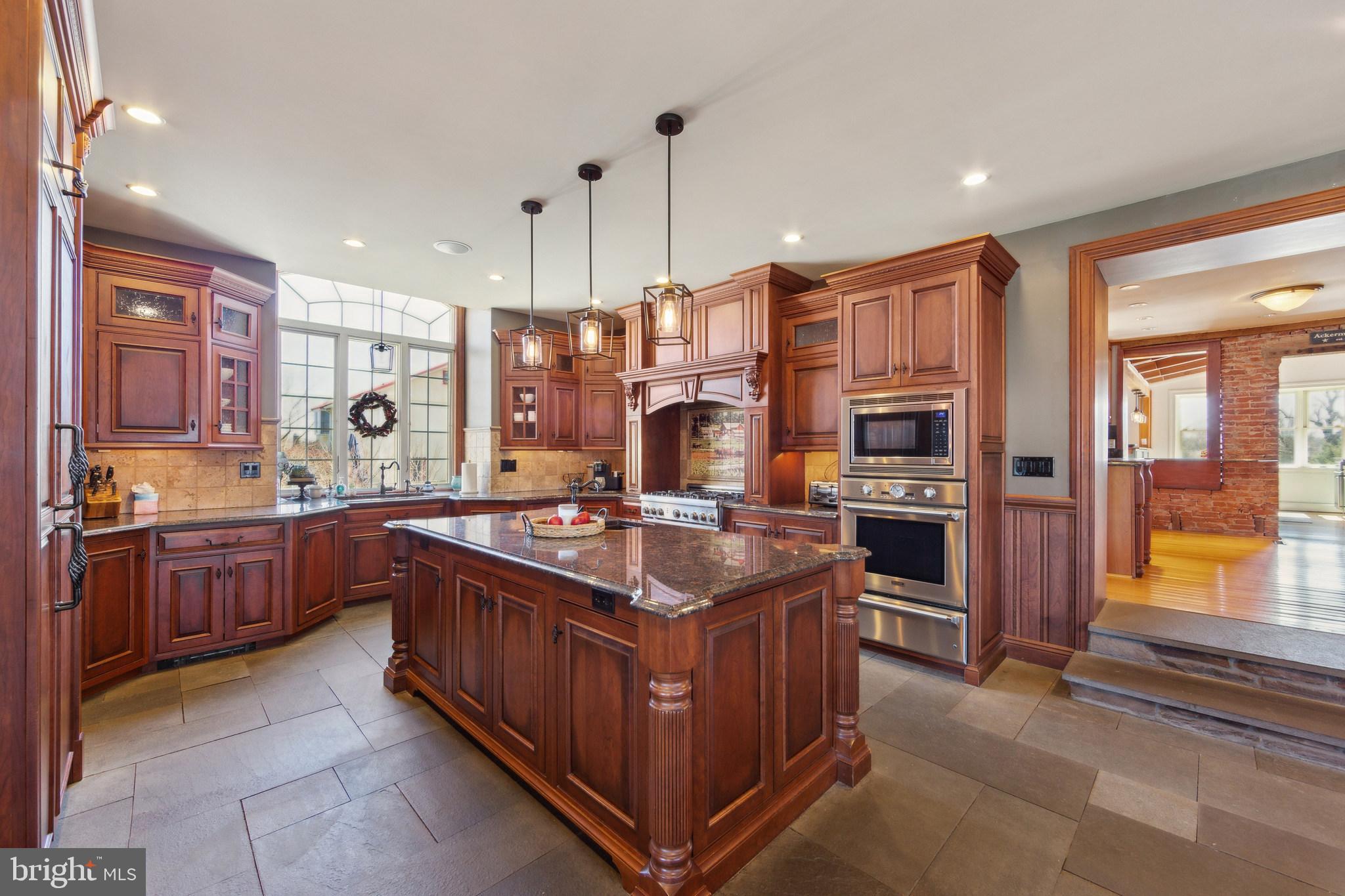 86 Sunset Road Royersford, PA 19468 - Photo 21 of 75 a kitchen with stainless steel appliances granite countertop a stove a sink a refrigerator and a oven
