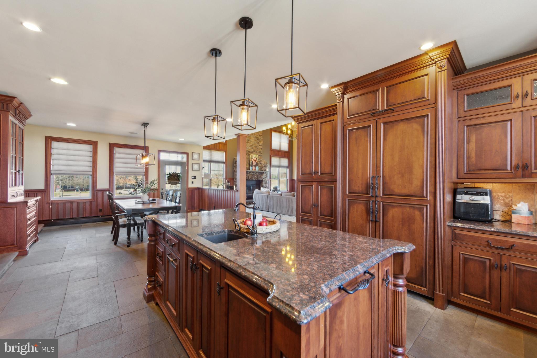 86 Sunset Road Royersford, PA 19468 - Photo 22 of 75 a kitchen with stainless steel appliances granite countertop a sink a stove and a wooden floors