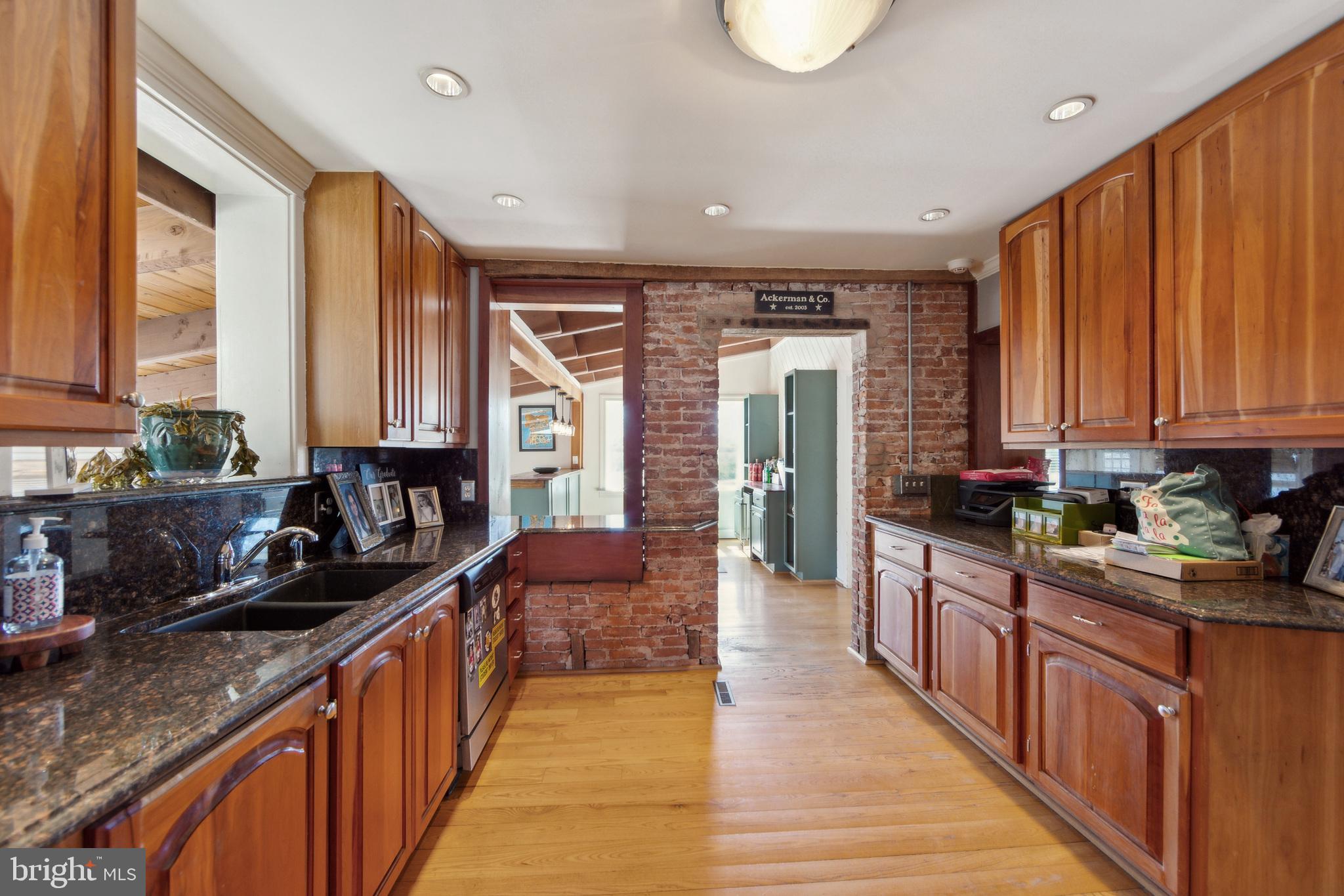 86 Sunset Road Royersford, PA 19468 - Photo 23 of 75 a kitchen with stainless steel appliances a sink dishwasher a stove a refrigerator with wooden cabinets and floor