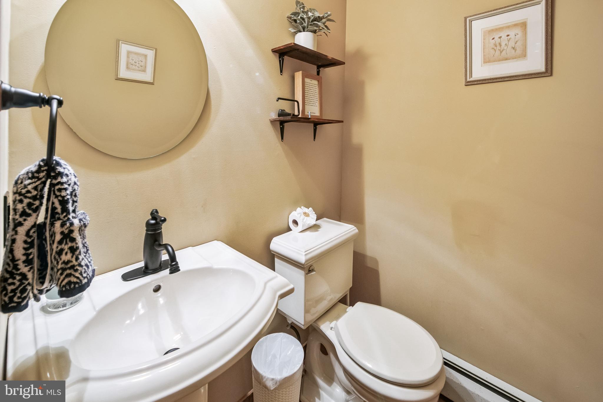 86 Sunset Road Royersford, PA 19468 - Photo 41 of 75 a bathroom with a toilet sink and mirror