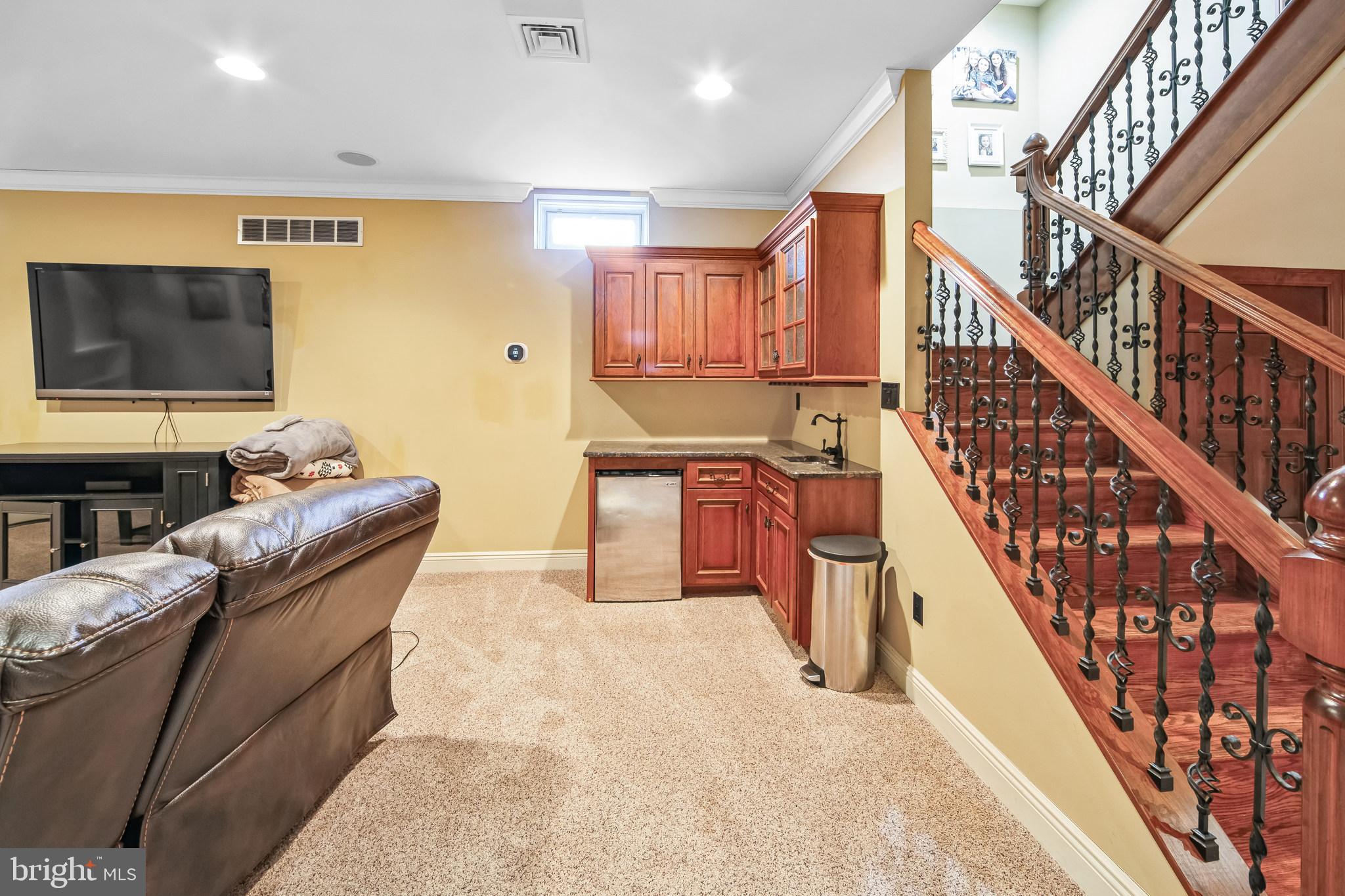 86 Sunset Road Royersford, PA 19468 - Photo 43 of 75 a living room with furniture and a flat screen tv
